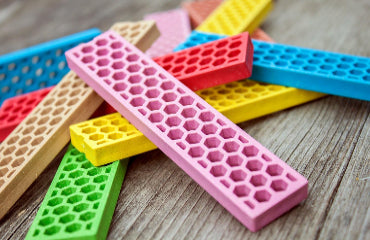 Close-up of colorful Perfect Blocks honeycomb blocks on a wooden table